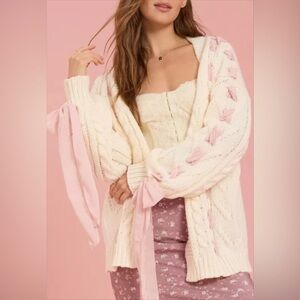 Altar'd State cable knit cardigan featuring ribbon lace-up details